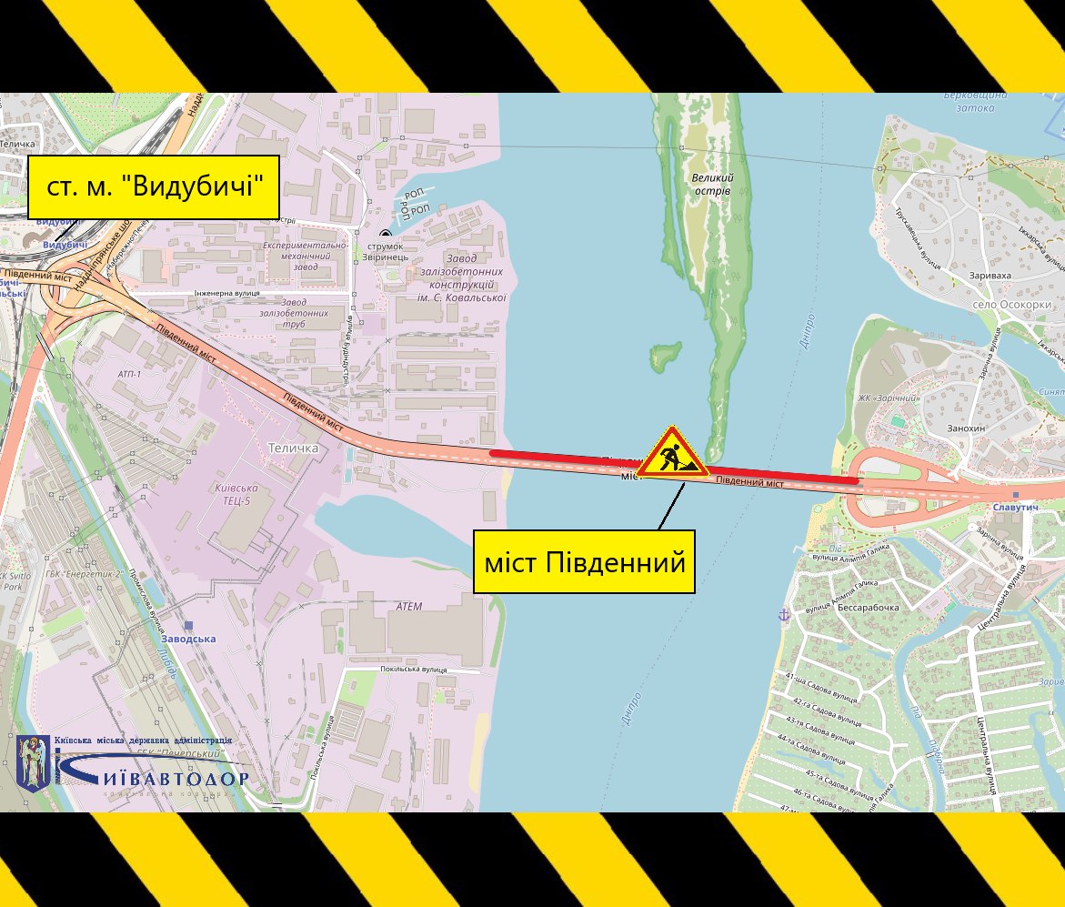 Інформаційна схема із картою ділянки Південного мосту в Києві. На карті показано маршрут від станції метро «Видубичі» через Південний міст у напрямку лівого берега. Ділянка мосту виділена червоною лінією, а в центрі мосту розміщено дорожній знак «Дорожні роботи», що вказує на місце проведення ремонтних робіт. На схемі підписані станція метро «Видубичі» та «міст Південний». По краях зображення розміщені чорно-жовті попереджувальні смуги, а в нижньому лівому куті — логотипи Київської міської державної адміністрації та КК «Київавтодор».