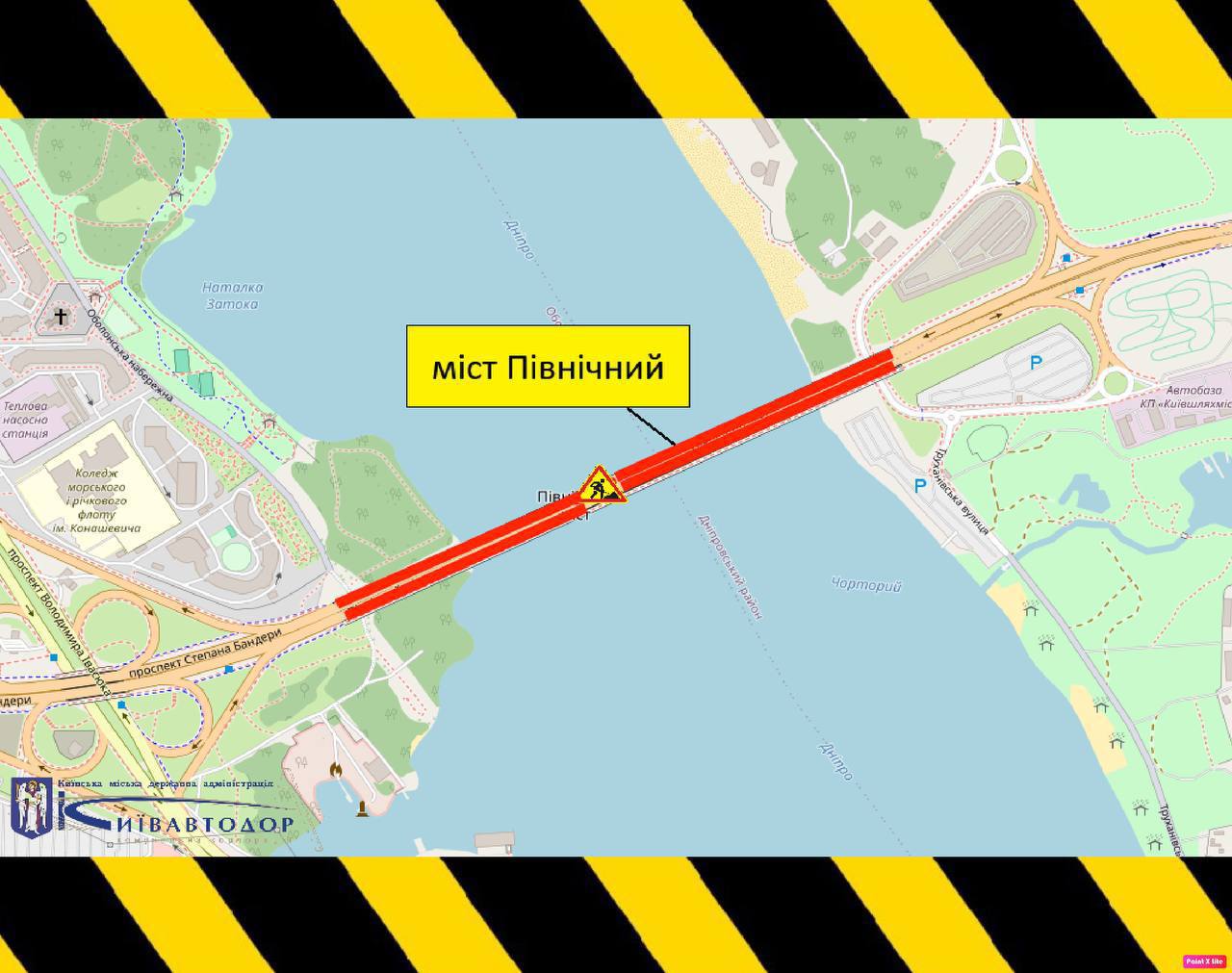 Схематична карта Києва з позначеним Північним мостом через Дніпро. Червоним виділено ділянку мосту з обмеженням руху, поруч знак дорожніх робіт. Зображено прилеглі дороги та розв’язки, по краях — попереджувальні чорно-жовті смуги.